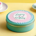 선물용 제과 제품 - **Prompt 1: Personalized Bento Cake in a Lunch Box**
    A charming, miniature bento cake, approxima...